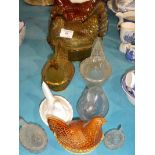 Ten glass and pottery chicken egg holders in various sizes