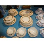 An Alfred Meakin cream and gilt 35 piece Dinner Service including tureens and soup set