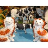 A large cast resin model cow and calf, resin cow and a pair of Staffordshire pottery fireside