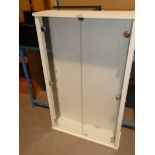 A white two door glazed display cabinet for model vehicles etc with 10 glass shelves.