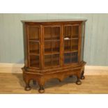 A 19th century Queen Ann revival figured walnut display cabinet on bun feet. W 122cm x D 38.5cm x