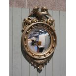 A 19th century convex captains mirror, refinished in gold spray