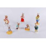 Seven Royal Doulton Bunnykins figures, unboxed, Father Bunnykins A/F