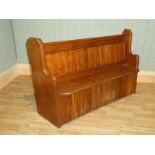 A Victorian pitch pine curved shaped pew 150cm