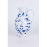 A German blue and white jug with strap handle, Sitgendorf mark to the base, 20.5cm H