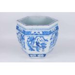 A late Qing Dynasty Chinese porcelain, blue and white hexagonal jardiniere, with figural panels