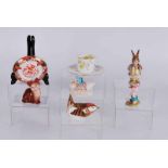 A small group of ceramics including a Royal Crown Derby Collectors Guild Finch paperweight, a
