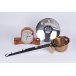 An interesting mixed lot including a Keswick School bowl, a clock and brass scoops