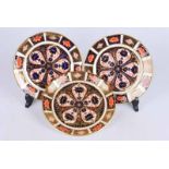 Two Royal Crown Derby Imari pattern sideplates and a Royal Crown Derby saucer (3)
