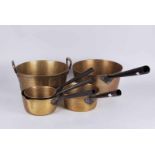 A group of vintage brass cooking pans with iron handles plus heavily cast preserve pan with brass