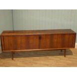 A large 1960s Scandanavian design tambour front sideboard, constructed from bookmatched South
