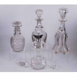 A group of decanters including a silver mounted Victorian waisted decanter, London 1897, two