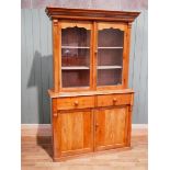 A Victorian pine elevated bookcase on two door base, 199 cm H