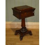 A William IV rosewood work table, the lid opening to reveal a compartmentalised well on lappet