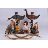 A Collection of Russian style dolls, painted eggs and wooden animals
