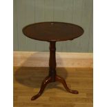 A George III mahogany dish top, tilting pedestal occasional table with tripartite base 59.5cm dia