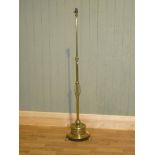 Edwardian brass standard lamp with heavy Bonnet shaped base on three feet, no shade. 120cm high,