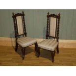 A pair of late 19th century mahogany child's chairs with upholstered backsplats between barley twist