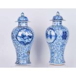 A pair of 19th century Chinese porcelain blue and white vase and covers, AF, spurious Kang Xi