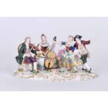 A 19th century figure group of string duet and dancers with Chelsea gold anchor mark, 9.5cm H
