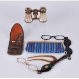 Two pairs of early 20th century faux tortoiseshell lorgnettes, a pair of M.O.P opera glasses, an
