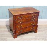 A modern walnut George III revival chest of four drawers, 66 cm H