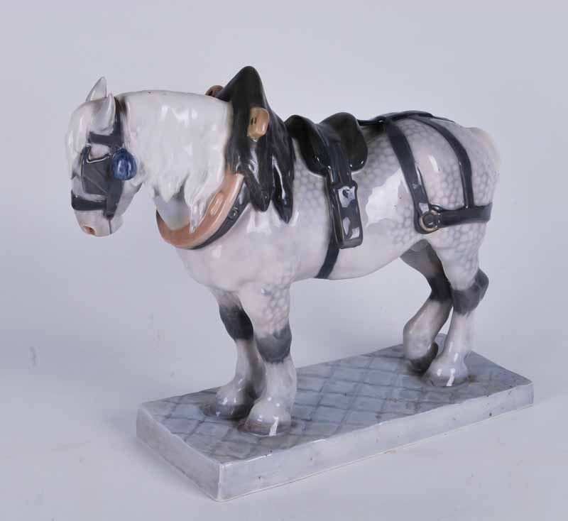 Royal Copenhagen large porcelain model of a Percheron cart horse, on a rectangular base, signed C.J.