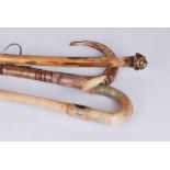 Three horn handled walking sticks, 135cm and smaller