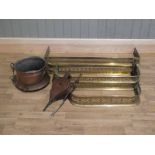 Four assorted graduated brass hearth fenders together with copper log bin, toasting fork and