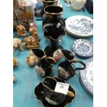 Seven items of modern Limoges porcelain jugs and vases