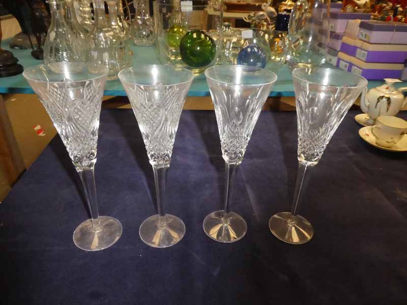 A set of 4 large Waterford Crystal Champagne Flutes