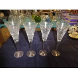 A set of 4 large Waterford Crystal Champagne Flutes