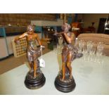 A pair of early 20th century patinated spelter figures of Improvisateur and Prisonniere by Ernest