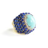 A PERSIAN TURQUOISE, DIAMOND, AND LAPIS LAZULI 18K YELLOW GOLD LADY'S RING, with a central oval