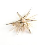 A MID-CENTURY MODERN DIAMOND, CULTURED PEARL, AND YELLOW GOLD STARBURST BROOCH, the radiating