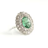 AN ANTIQUE 18K WHITE GOLD, MINE CUT DIAMOND, AND EMERALD RING, LATE 19TH/EARLY 20TH CENTURY, a
