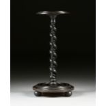A VICTORIAN EBONIZED AND CARVED WOOD PEDESTAL STAND, SECOND HALF 19TH CENTURY, with a circular top