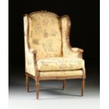 A LOUIS XVI STYLE GILTWOOD AND SCALAMANDRÉ UPHOLSTERED BERGÈRE A L'OREILLES, EARLY 20TH CENTURY,