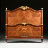 A FINE LOUIS XVI STYLE ORMOLU MOUNTED TULIPWOOD AND VARIOUS WOODS INLAID MARQUETRY BED, SIGNED, LATE