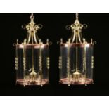 A PAIR OF REGENCY STYLE BRASS, COPPER, AND GLASS FOUR-LIGHT HALL LANTERNS, EARLY/MID 20TH CENTURY,