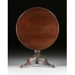 AN AMERICAN CLASSICAL PERIOD MAHOGANY TILT-TOP BREAKFAST TABLE, 1820s, the circular top with