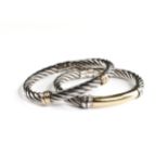 A PAIR OF ITALIAN 18K YELLOW GOLD AND STERLING SILVER ROPE-TWIST BANGLES, 20TH CENTURY, the spring