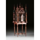 A VICTORIAN STYLE WIRE AND CARVED WOOD CATHEDRAL BIRDCAGE, MODERN, with four two story turret