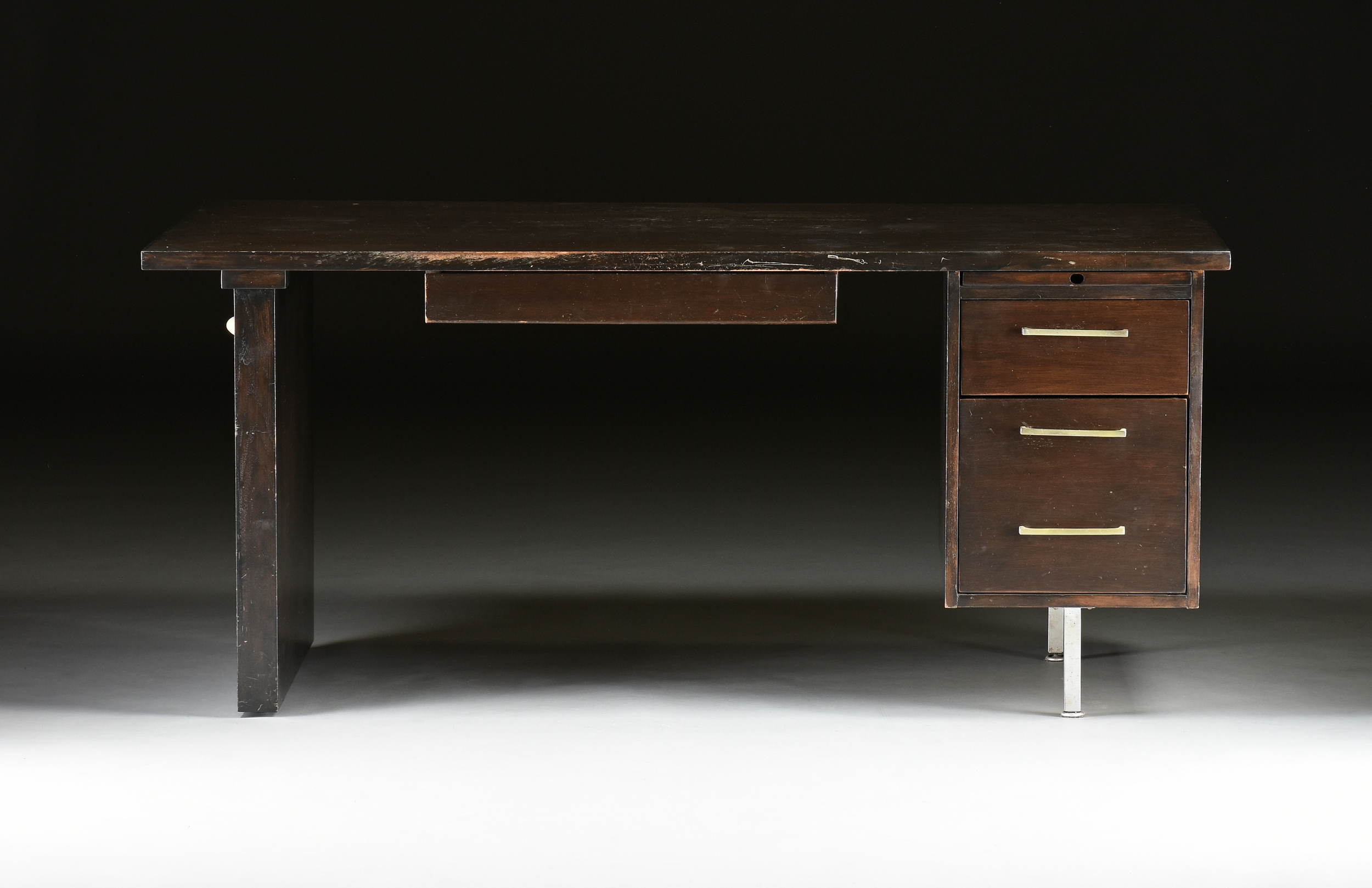 A MODERNIST BLACK STAINED WOOD AND STEEL OFFICE DESK, LAST QUARTER 20TH CENTURY, the rectangular top