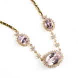 A KUNZITE, DIAMOND, AND 18K YELLOW GOLD NECKLACE, MODERN, with a reed-and-disc gold demi necklace