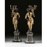 A PAIR OF VENETIAN STYLE GILT AND PATINATED BRONZE BLACKAMOOR SEVEN-LIGHT CANDELABRAS, 20TH CENTURY,