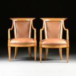 A PAIR OF BIEDERMEIER STYLE FAUX LEATHER UPHOLSTERED MAPLE ARMCHAIRS, 20TH CENTURY, the curled