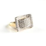 A LAURA RAMSEY PAVÉ DIAMOND AND 14K YELLOW GOLD RING, MARKED, of stylized buckle form with the