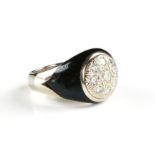 A MEN'S ART DECO STYLE DIAMOND, BLACK ONYX, AND 14K WHITE GOLD RING, the domed white gold top with