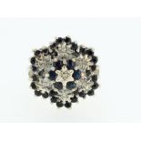 A 9ct gold sapphire and diamond cluster ring - size N